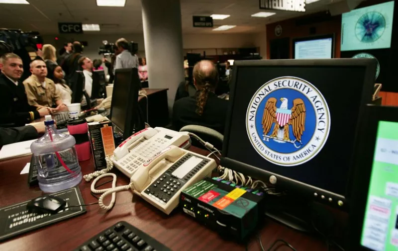 A computer workstation bears the National Security Agency (NSA) logo inside the Threat Operations Center inside the Washington suburb of Fort Meade, Maryland, intelligence gathering operation 25 January 2006 after US President George W. Bush delivered a speech behind closed doors and met with employees in advance of Senate hearings on the much-criticized domestic surveillance. / AFP PHOTO / PAUL J. RICHARDS