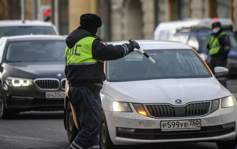 8113767 12.02.2022 A traffic police officer gives the driver a signal to stop on a street in Moscow, Russia.,Image: 662134387, License: Rights-managed, Restrictions: Editors' note: THIS IMAGE IS PROVIDED BY RUSSIAN STATE-OWNED AGENCY SPUTNIK., Model Release: no