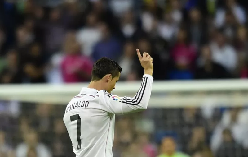 Real Madrid's Portuguese forward Cristiano Ronaldo gestures during the Spanish league football match Real Madrid CF vs UD Almeria at the Santiago Bernabeu stadium in Madrid on April 29, 2015.   AFP PHOTO/ JAVIER SORIANO
