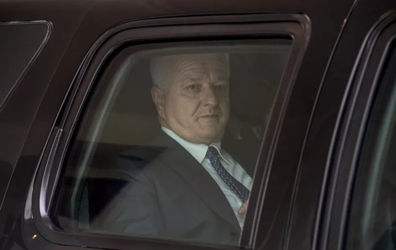 Montenegrin Prime Minister Dusko Markovic drives off in his car after talks with US Vice President Mike Pence at the White House in Washington, DC, on June 5, 2017.
Montenegro became NATO's 29th member on June 5, 2017. / AFP PHOTO / NICHOLAS KAMM