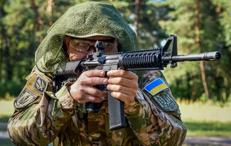 A Ukrainian civilian takes part in military training in Lviv region in western Ukraine on August 3, 2022, amid Russian invasion of Ukraine. (Photo by YURIY DYACHYSHYN / AFP)