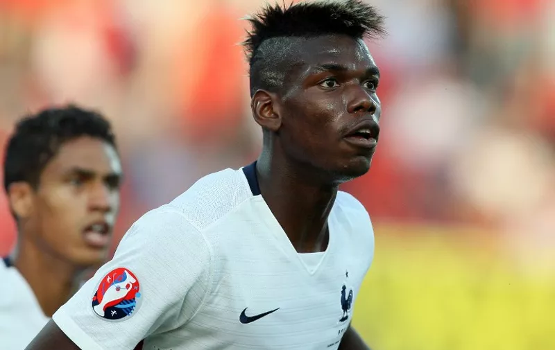 France's midfielder Paul Pogba eyes the ball during  the friendly football match Albania between France at the Elbasan Arena stadium in Elbasan on June 13, 2015. AFP PHOTO / GENT SHKULLAKU