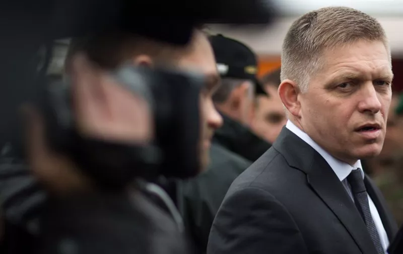 Slovak Prime Minister Robert Fico speaks to media after a joint exercise of Slovak police and Slovak Army, focused on protecting public order at the borders near Bratislava, on October 29, 2015. Slovakia, a nation of 5,4 million people is among several eastern EU members staunchly opposed to a quota system distributing refugees among the bloc's 28 members.    AFP PHOTO / VLADIMIR SIMICEK / AFP / VLADIMIR SIMICEK