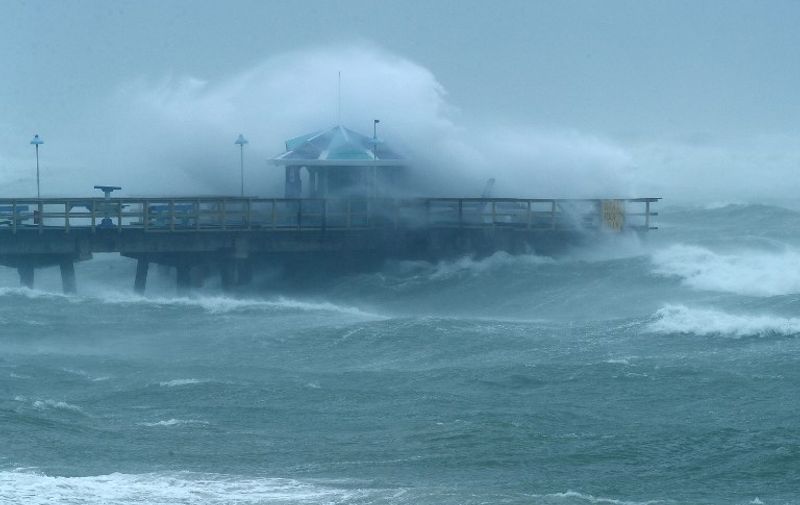 FORT LAUDERDALE, FL - SEPTEMBER 10: Large waves produced by Hurricane Irma crash into the end of Anglins Fishing Pier September 10, 2017 in Fort Lauderdale, Florida. The category 4 hurricane made landfall in the United States in the Florida Keys at 9:10 a.m. after raking across the north coast of Cuba.   Chip Somodevilla/Getty Images/AFP