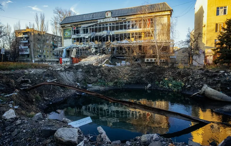 (FILES) This photograph taken on November 29, 2022, shows a destroyed building in Bakhmut, Donetsk region, amid the Russian invasion of Ukraine. Russia's private army Wagner claimed on May 20, 2023, the total control of the east Ukrainian city of Bakhmut, the epicentre of fighting, as Kyiv said the battle was continuing but admitted the situation was "critical". Bakhmut, a salt mining town that once had a population of 70,000 people, has been the scene of the longest and bloodiest battle in Moscow's more than year-long Ukraine offensive. The fall to Russia of Bakhmut, where both Moscow and Kyiv are believed to have suffered huge losses, would have high symbolic value. (Photo by Yevhen TITOV / AFP)