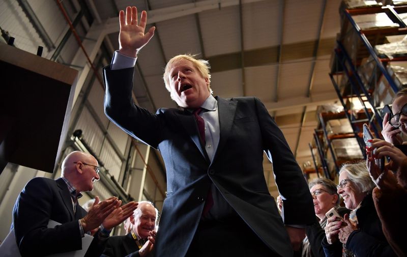 Britain's Prime Minister and Conservative party leader Boris Johnson arrives to speak at a general election campaign rally, near Gloucester, western England, on December 9, 2019. - Britain will go to the polls on December 12, 2019 to vote in a pre-Christmas general election. (Photo by Ben STANSALL / POOL / AFP)