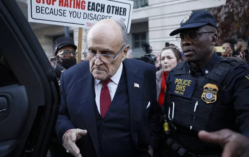 WASHINGTON, DC - DECEMBER 15: Rudy Giuliani, the former personal lawyer for former U.S. President Donald Trump, departs from the E. Barrett Prettyman U.S. District Courthouse after a verdict was reached in his defamation jury trial on December 15, 2023 in Washington, DC. A jury has ordered Giuliani to pay $148 million in damages to Fulton County election workers Ruby Freeman and Shaye Moss.   Anna Moneymaker/Getty Images/AFP (Photo by Anna Moneymaker / GETTY IMAGES NORTH AMERICA / Getty Images via AFP)