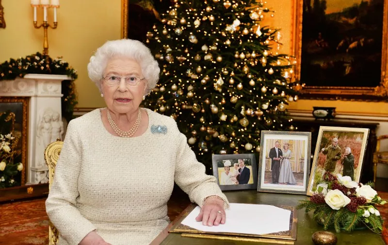 EDITORS NOTE - THIS PICTURE IS EMBARGOED TO 0001 GMT ON DECEMBER 25, 2015 THIS RESTRICTION APPLIES TO ALL MEDIA INCLUDING WEBSITES

Britain's Queen Elizabeth II is pictured after recording her Chistmas Day broadcast to the Commonwealth in the 18th Century Room at Buckingham Palace in London on December 10, 2015. 
AFP PHOTO / POOL / John Stillwell / AFP / POOL / JOHN STILLWELL