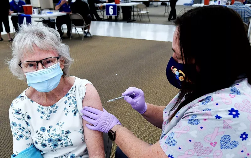 Nurse Lacinda Snowberger gives Priscilla Lockhart a shot of the Pfizer vaccine at a walk-in COVID-19 vaccination POD inside a vacant Sears store at the Lake Square Mall.
The appointment-only site for frontline health care workers and seniors 65 and older is vaccinating around 700 people a day.
COVID-19 Vaccinations Offered at Shopping Mall in Leesburg, US - 29 Jan 2021,Image: 587170407, License: Rights-managed, Restrictions: , Model Release: no