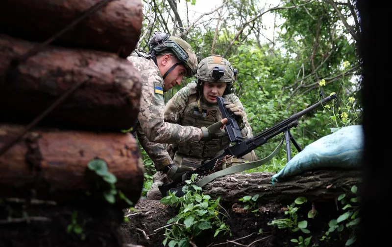 Ukrainian soldiers of the 28th Separate Mechanized Brigade hold their positions at the front line near the town of Bakhmut, Donetsk region, on June 17, 2023, amid the Russian invasion of Ukraine. (Photo by Anatolii STEPANOV / AFP)
