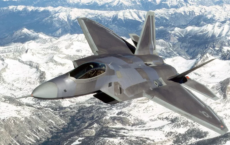 (FILES) An undated file photo provided by Lockheed Martin shows a F-22 Raptor in flight. The first Raptor will join the 27th Fighter Squadron at Langley Air Force Base in Virginia 27 October, 2004 after leaving Lockheed's plant  in Marietta, Georgia. (Lockheed Martin via Getty Images/AFP) (Photo by Getty Images / Getty Images North America / Getty Images via AFP)