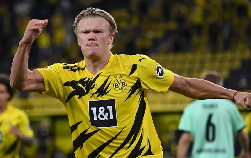 Dortmund's Norwegian forward Erling Braut Haaland celebrates scoring during the German first division Bundesliga football match Borussia Dortmund v Borussia Moenchengladbach in Dortmund, western Germany on September 19, 2020. (Photo by Ina Fassbender / AFP) / DFL REGULATIONS PROHIBIT ANY USE OF PHOTOGRAPHS AS IMAGE SEQUENCES AND/OR QUASI-VIDEO
