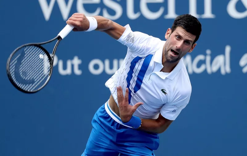 NEW YORK, NEW YORK - AUGUST 28: Novak Djokovic of Serbia serves to Roberto Bautista Agut of Spain in their semifinal match during the Western &amp; Southern Open at the USTA Billie Jean King National Tennis Center on August 28, 2020 in the Queens borough of New York City. (Photo by Matthew Stockman/Getty Images)