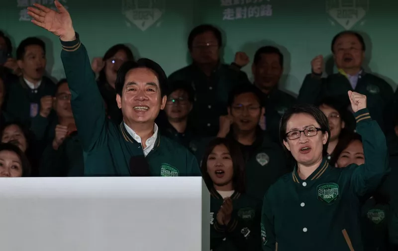 Taiwan's President-elect Lai Ching-te (L) waves beside his running mate Hsiao Bi-khim during a rally outside the headquarters of the Democratic Progressive Party (DPP) in Taipei on January 13, 2024, after winning the presidential election. Taiwan's ruling party candidate Lai Ching-te, branded a threat to peace by China, on January 13 won the island's presidential election, a vote watched closely from Beijing to Washington. (Photo by Yasuyoshi CHIBA / AFP)