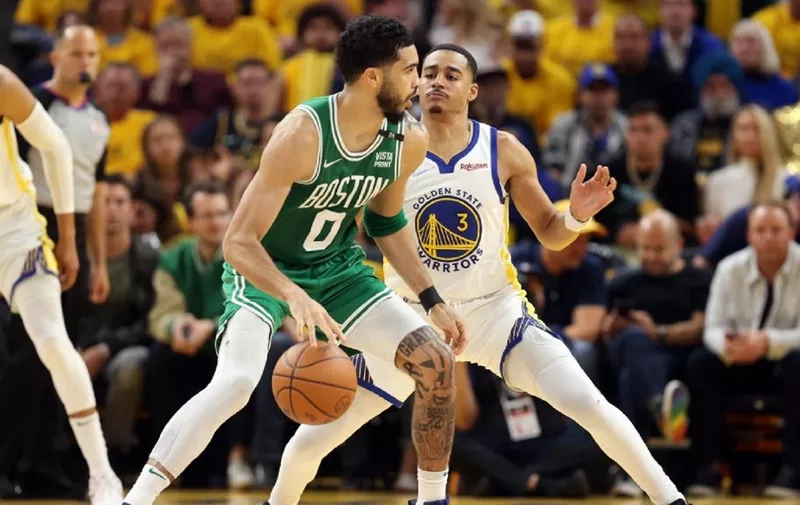 SAN FRANCISCO, CALIFORNIA - JUNE 02: Jayson Tatum #0 of the Boston Celtics dribbles against Jordan Poole #3 of the Golden State Warriors during the fourth quarter in Game One of the 2022 NBA Finals at Chase Center on June 02, 2022 in San Francisco, California. NOTE TO USER: User expressly acknowledges and agrees that, by downloading and/or using this photograph, User is consenting to the terms and conditions of the Getty Images License Agreement.   Ezra Shaw/Getty Images/AFP (Photo by EZRA SHAW / GETTY IMAGES NORTH AMERICA / Getty Images via AFP)