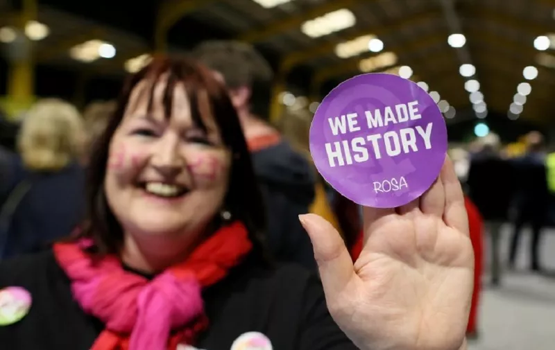 A Yes voter poses with a badge as votes are counted in the Irish abortion referendum, at the RDS Conference centre in Dublin on May 26, 2018. 
Ireland looks set to "make history" by liberalising some of the strictest abortion laws in Europe, Prime Minister Leo Varadkar said as votes in the hard-fought referendum were counted on May 26, 2018. / AFP PHOTO / Paul FAITH