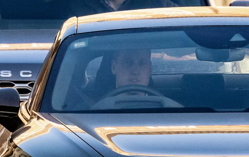 Britain's Prince William, Prince of Wales drives himself away from the London Clinic in London on January 18, 2024 where his wife Britain's Catherine, Princess of Wales, underwent surgery. Britain's Catherine, Princess of Wales, is facing up to two weeks in hospital after undergoing successful abdominal surgery, Kensington Palace announced on January 17. (Photo by HENRY NICHOLLS / AFP)