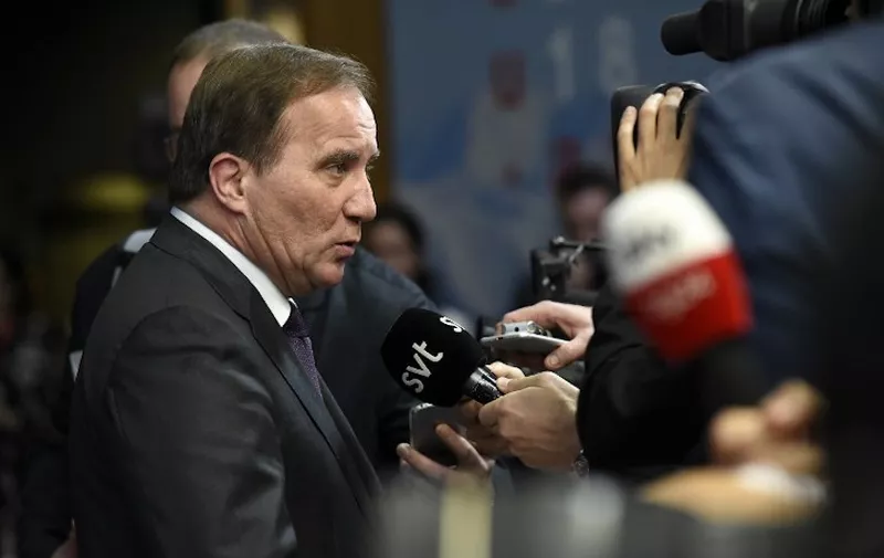 Sweden's Prime Minister Stefan Lofven speaks to journalists upon his arrival at the European Council in Brussels on October 17, 2018. - British Prime Minister Theresa May is due to address a summit of European Union leaders in which Brexit negotiations are expected to be top of the agenda. (Photo by JOHN THYS / AFP)
