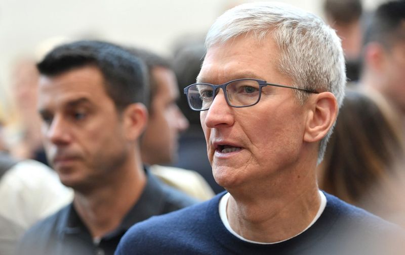 Apple CEO Tim Cook speaks with attendees during an Apple product launch event at Apple's headquarters in Cupertino, California on September 10, 2019. - Apple unveiled its iPhone 11 models Tuesday, touting upgraded, ultra-wide cameras as it updated its popular smartphone lineup and cut its entry price to $699. (Photo by Josh Edelson / AFP)