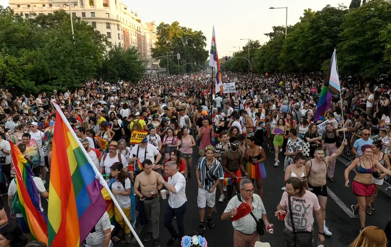 Participants take part in the "Marcha del Orgullo" Pride parade in Madrid, on July 9, 2022. MADO (Madrid Pride) is a series of street celebrations that take place during the city´s LGBTIQ (lesbian, gay, bisexual, transgender, intersex and queer) Pride week. The Pride parade is the highlight of the week. (Photo by OSCAR DEL POZO / AFP)