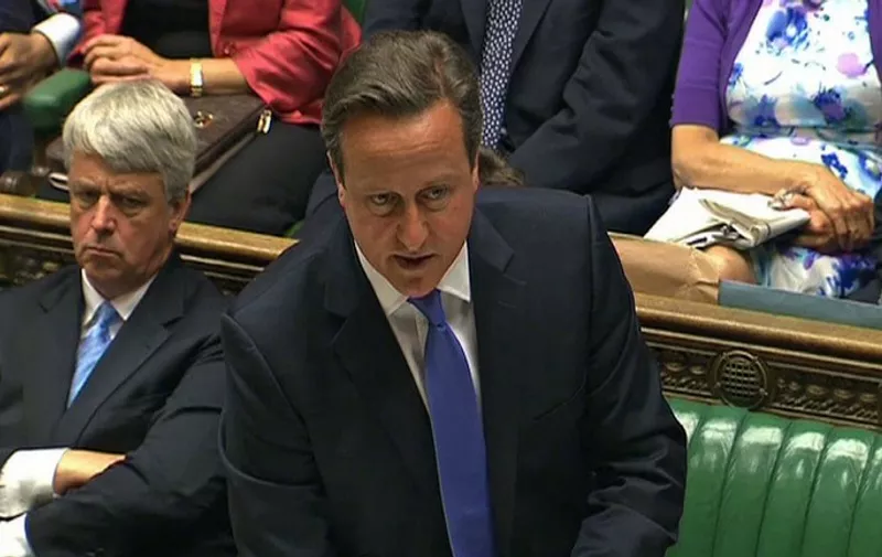 In an image grab from pooled video footage taken on June 25, 2014 British Prime Minister David Cameron speaks during Prime Minister's questions in the House of Commons in central London. British Prime Minister David Cameron apologised to parliament on Wednesday for hiring former News of the World editor Andy Coulson after his conviction for phone hacking, but faced fresh embarrassment as the trial judge rebuked him for speaking out about the case. Cameron said it had been the "wrong decision" to make Coulson his media chief in 2007 but denied ignoring warnings about his activities at the tabloid, which Rupert Murdoch shut down in disgrace in July 2011. RESTRICTED TO EDITORIAL USE - MANDATORY CREDIT " AFP PHOTO / POOL " - NO MARKETING NO ADVERTISING CAMPAIGNS - NO RESALE