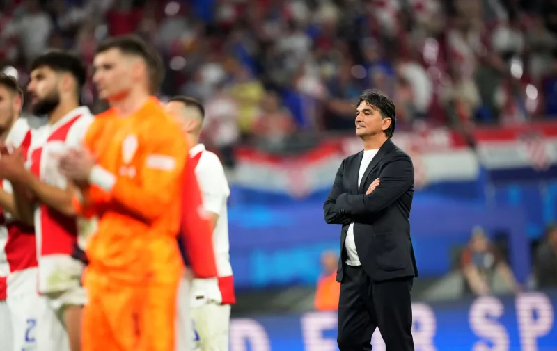 Croatia's head coach Zlatko Dalic, right, reacts with his teammates at the end of a Group B match between Croatia and Italy at the Euro 2024 soccer tournament in Leipzig, Germany, Monday, June 24, 2024. (AP Photo/Ebrahim Noroozi)