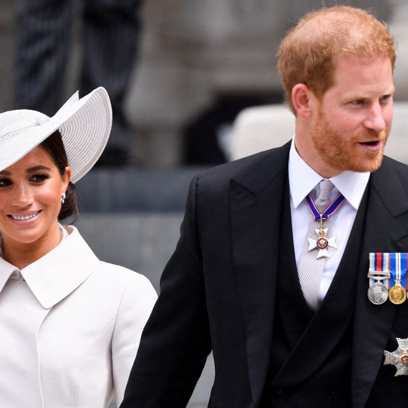 Britain's Prince Harry and his wife Meghan, the Duke and Duchess of Sussex, leave at the end of the National Service of Thanksgiving for The Queen's reign at Saint Paul's Cathedral in London on June 3, 2022 as part of Queen Elizabeth II's platinum jubilee celebrations. - Queen Elizabeth II kicked off the first of four days of celebrations marking her record-breaking 70 years on the throne, to cheering crowds of tens of thousands of people. But the 96-year-old sovereign's appearance at the Platinum Jubilee -- a milestone never previously reached by a British monarch -- took its toll, forcing her to pull out of a planned church service. (Photo by TOBY MELVILLE / POOL / AFP)
