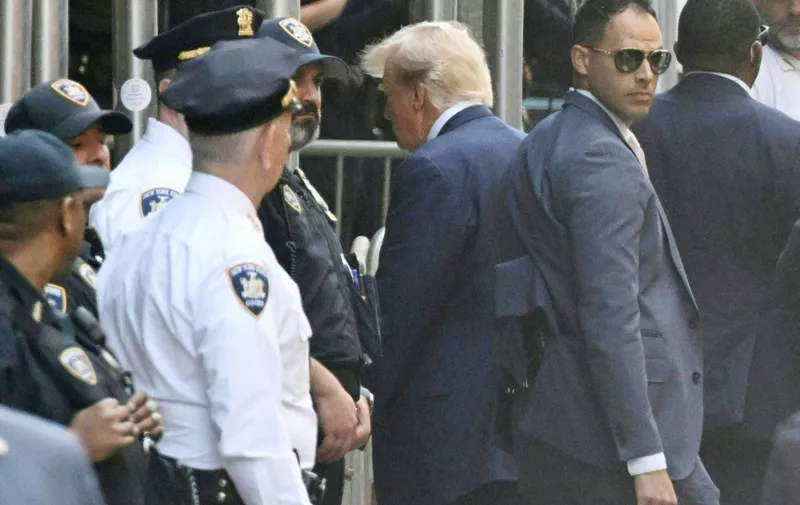 Former US president Donald Trump arrives ahead of his arraignment at the Manhattan Criminal Court in New York on April 4, 2023. - Former US president Donald Trump arrived for a historic court appearance in New York on Tuesday, facing criminal charges that threaten to upend the 2024 White House race. (Photo by ANDREW CABALLERO-REYNOLDS / AFP)