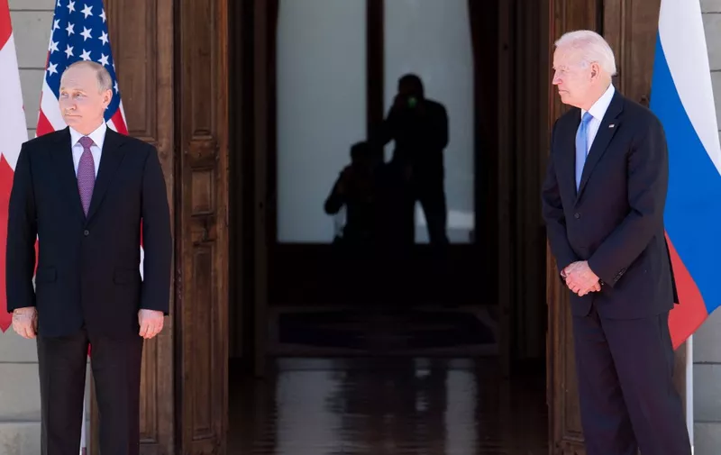 Russian President Vladimir Putin (L) looks on, next to US President Joe Biden (R), prior to the US-Russia summit at the Villa La Grange, in Geneva on June 16, 2021. (Photo by Brendan Smialowski / AFP)