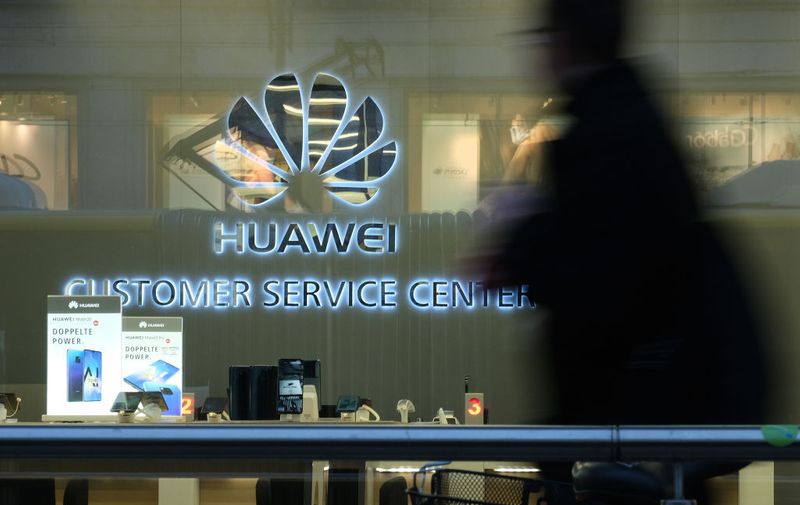 BERLIN, GERMANY - MARCH 12: A man walks past a Huawei customer service center on March 12, 2019 in Berlin, Germany.
 The U.S. government has warned Germany not to consider Huawei for the construction of Germany's new 5G mobile data network due to security fears. U.S. Ambassador Richard Grenell told the Germans that the U.S. would reconsider its sharing of intelligence with Germany if any Chinese companies supplied hardware for the German 5G network.  (Photo by Sean Gallup/Getty Images)