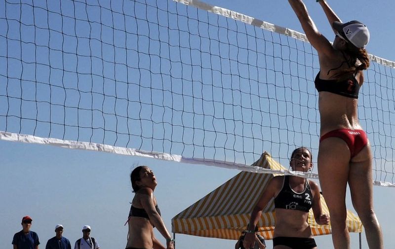 Members of the Puerto Rican beach volley female team compete against Costa Rica, during the NORCECA Circuit Varadero 2011, on August 26, 2011 in Varadero, Matanzas, Cuba. AFP PHOTO/STR (Photo by STR / AFP)