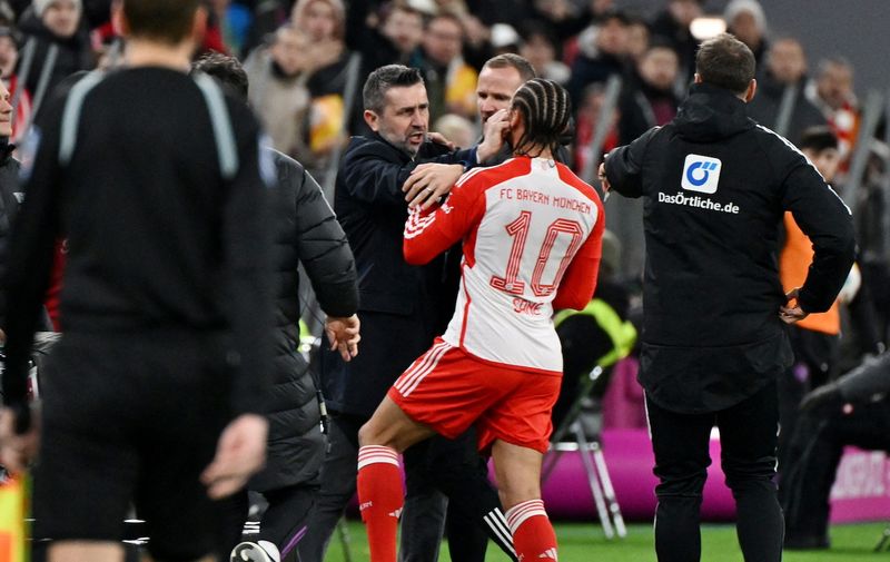 Soccer Football - Bundesliga - Bayern Munich v 1. FC Union Berlin - Allianz Arena, Munich, Germany - January 24, 2024
1. FC Union Berlin coach Nenad Bjelica clashes with Bayern Munich's Leroy Sane before being shown a red card by referee Frank Willenborg REUTERS/Angelika Warmuth DFL REGULATIONS PROHIBIT ANY USE OF PHOTOGRAPHS AS IMAGE SEQUENCES AND/OR QUASI-VIDEO.