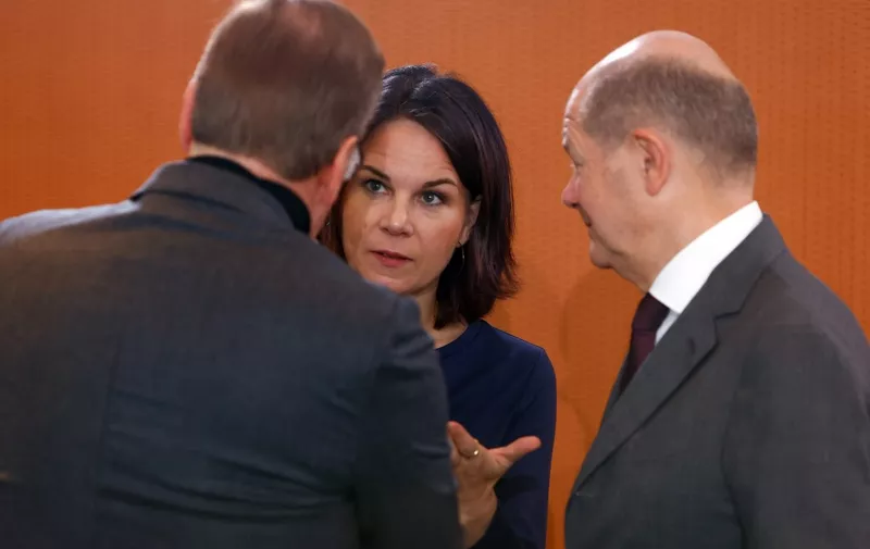 German Foreign Minister Annalena Baerbock (C) speaks with German Chancellor Olaf Scholz (R) and German Defence Minister Boris Pistorius as they arrive for the weekly cabinet meeting on October 25, 2023 at the Chancellery in Berlin, Germany. (Photo by MICHELE TANTUSSI / AFP)