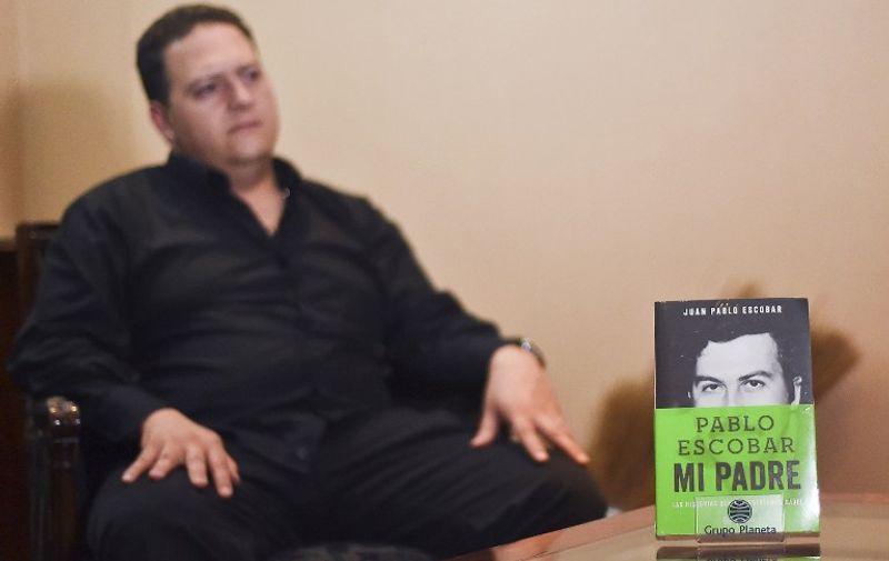 Juan Pablo Escobar, son of Colombian drug kingpin Pablo Escobar, speaks about the book he wrote about his father, during an interview with AFP in Bogota on November 7, 2014. The Medellin cartel founder, Escobar, was famed for some of the bloodiest, most ruthless organized crime dealings, like the cartel's "plata o plomo" policy on the street ("take a payoff, or you are dead.")    AFP PHOTO/Luis Acosta