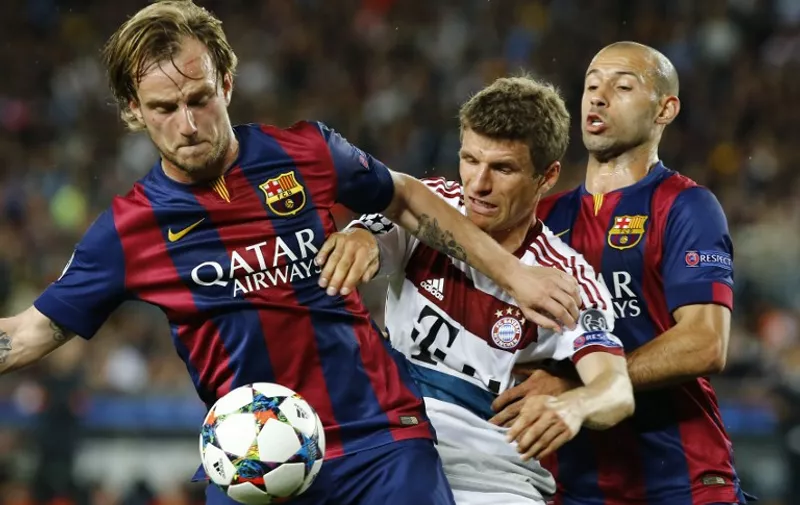 (150507) -- BARCELONA, May 7, 2015 () -- Barcelona's Croatian midfielder Ivan Rakitic (L) and Argentine defender Javier Mascherano (R) vie with FC Bayern Munich's German forward Thomas Muller during their first round match of semifinal at the 2014-2015 UEFA Champions League at Camp Nou Stadium in Barcelona, Spain, May 6, 2015. Barcelona won 3-0. (/Pau Barrena)