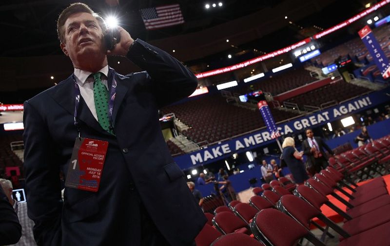 CLEVELAND, OH - JULY 17: Paul Manafort, Campaign Manager for Donald Trump, speaks on the phone while touring the floor of the Republican National Convention at the Quicken Loans Arena as final preparations continue July 17, 2016 in Cleveland, Ohio. The Republican National Convention begins July 18.   Win McNamee/Getty Images/AFP