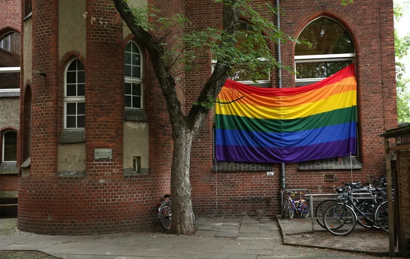 A rainbow flag hangs outside the Ibn Rushd-Goethe mosque in Berlin, Germany on July 1, 2022. - The flag was hoisted prior to Friday prayers in order to set a sign, especially for members of the muslim community, that they don't have to choose between their faith and their sexual identity, but are accepted as they are. (Photo by Adam BERRY / AFP)