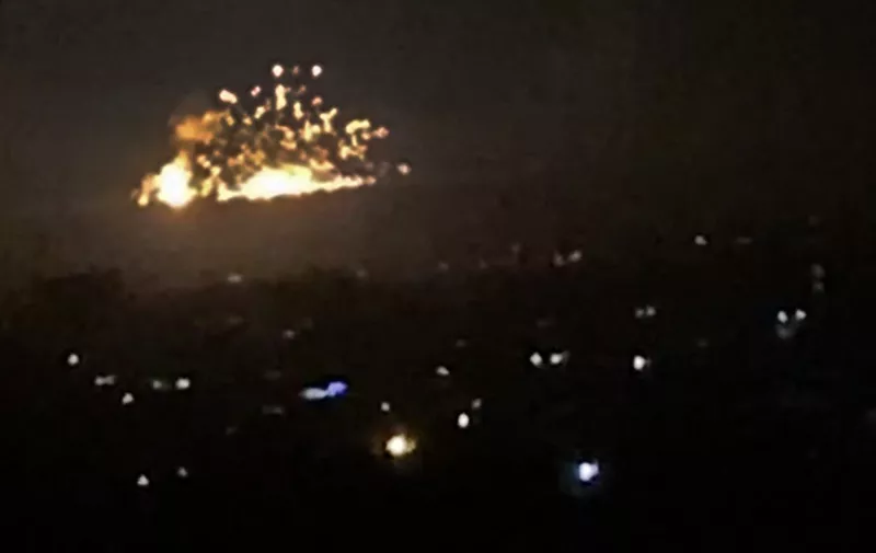 An image grab shows on November 20, 2019 smoke and fire billowing during a reported  Israeli air strike on the outskirts of Damascus. The Israeli army confirmed that it carried out strikes against military sites in Damascus today, in response to rocket fire from Syria the previous day. "We just carried out wide-scale strikes of Iranian Quds Force &amp; Syrian Armed Forces targets in Syria in response to the rockets fired at Israel by an Iranian force in Syria," the Israel Defense Forces tweeted. Syria's state media earlier said Syrian anti-aircraft defences intercepted a "heavy attack" by Israeli warplanes over the capital Damascus. (Photo by AFP)