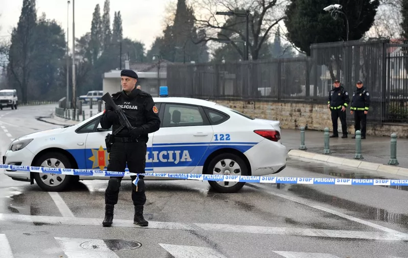 Police officers stand guard as they block the area around the US Embassy in Montenegro's capital Podgorica on February 22, 2018 following a suicide bomber attack into the US embassy compound. - An unknown attacker blew themself up after throwing a suspected grenade into the US embassy compound in Podgorica, the Montenegrin government said on February 22, 2018. Authorities in Podgorica have not released any theories as to the motive for the attack in the country which recently joined NATO despite opposition from some of the population and from where a number of jihadists have travelled to Iraq and Syria. (Photo by SAVO PRELEVIC / AFP)