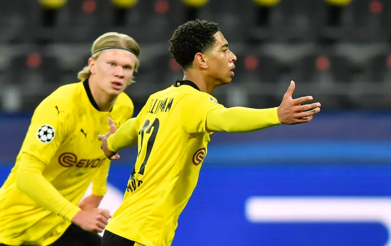 Dortmund's Jude Bellingham, right, celebrates after scoring his side's first goal during the Champions League quarterfinal second leg soccer match between Borussia Dortmund and Manchester City at the Signal Iduna Park stadium in Dortmund, Germany, Wednesday, April 14, 2021. (AP Photo/Martin Meissner, Pool)