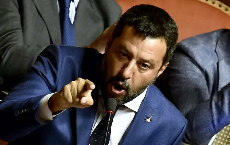 Italian Deputy Prime Minister and leader of the far-right League party Matteo Salvini gestures while speaking at the upper house, as senators hold a debate on a possible no-confidence vote in the government, in Rome's Palazzo Madama on August 13, 2019. - The Italian Senate on August 13, 2019 rejected a call by far-right leader Matteo Salvini for a swift no-confidence vote, deciding instead for Prime Minister to address the crisis on August 20. Interior Minister's anti-migrant League had sought the vote after he pulled the plug on the coalition last week, but a majority of senators from former coalition partners Five Star Movement and from the opposition rejected the motion. (Photo by Filippo MONTEFORTE / AFP)