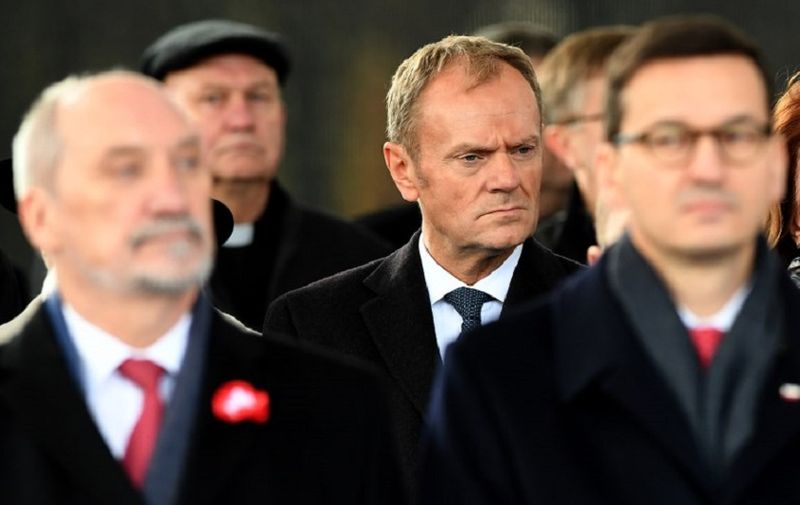 Former Polish Prime Minister and European Council President Donald Tusk (C), Polish Defence Minister Antoni Macierewicz (L) and Deputy Prime MInister Mateusz Morawiecki (R) attend ceremonies on Poland's Independence Day on November 11, 2017 in Warsaw, Poland.
Donald Tusk was back in his homeland on November 11, 2017 to attend a ceremony marking Poland's independence day, at a time when the governing conservatives have been increasingly at odds with Brussels. / AFP PHOTO / JANEK SKARZYNSKI