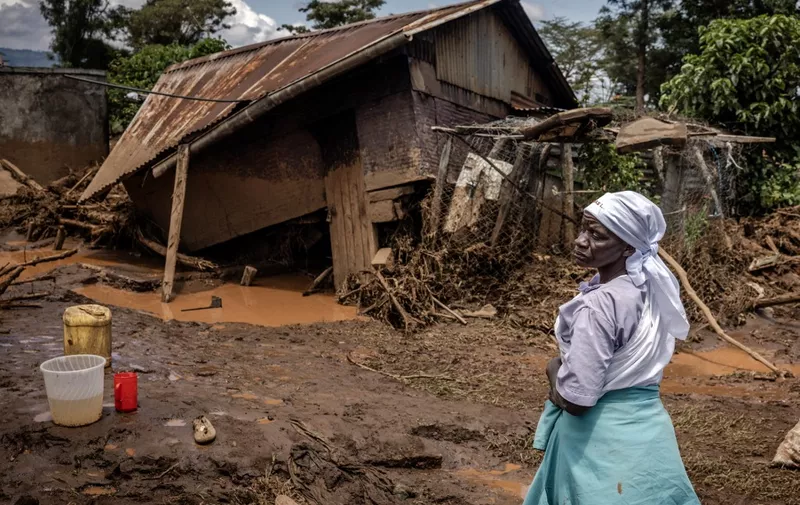 A woman stands assessing the damage in front of her destroyed house in an area heavily affected by torrential rains and flash floods in the village of Kamuchiri, near Mai Mahiu, on April 29, 2024. At least 45 people died when a dam burst its banks near a town in Kenya's Rift Valley, police said on April 29, 2024, as torrential rains and floods battered the country.
The disaster raises the total death toll over the March-May wet season in Kenya to more than 120 as heavier than usual rainfall pounds East Africa, compounded by the El Nino weather pattern. (Photo by LUIS TATO / AFP)