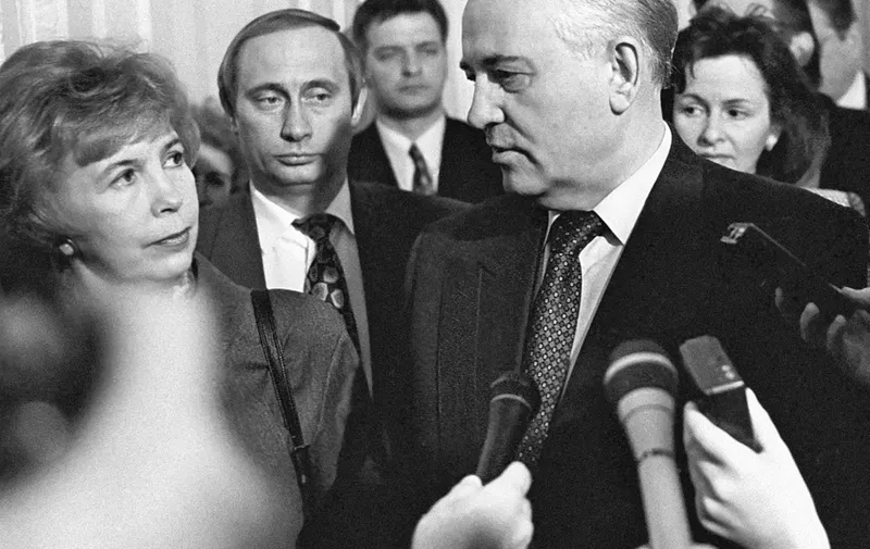 May 10, 1994, St. Petersburg, Russia: President of the Soviet Union, Mikhail Gorbachev with his spouse Raisa Gorbacheva. VLADIMIR PUTIN, the chairman of the city's Foreign Relations Committee is pictured behind them.,Image: 130541934, License: Rights-managed, Restrictions: , Model Release: no, Pictured: Putin Vladimir