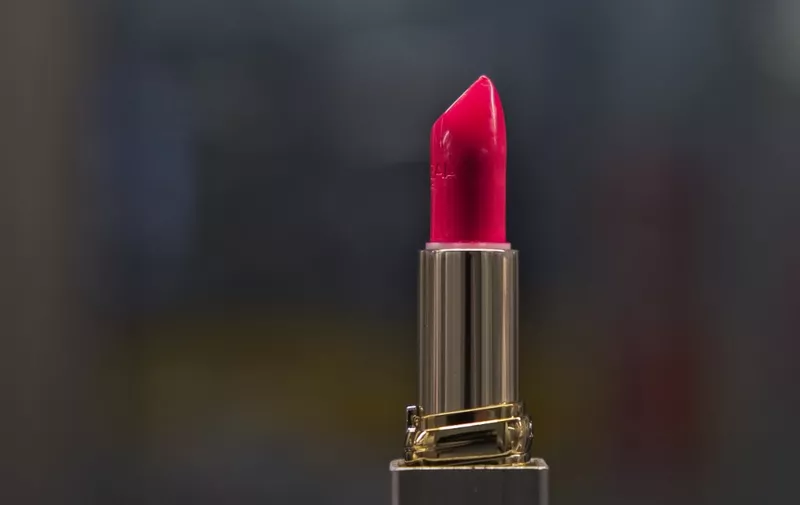 This photograph taken at the French cosmetic company 'L'Oreal' on November 17, 2022, shows a lipstick at the production centre in L'Oreal factory in Ormes, central France. (Photo by GUILLAUME SOUVANT / AFP)