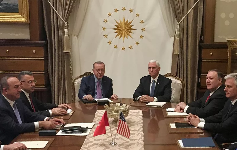 Turkish President Recep Tayyip Erdogan (C-L) and US Vice President Mike Pence (C-R), joined by Secretary of State Mike Pompeo (4R), Turkish Vice President Fuat Oktay (4L), Turkish Foreign Minister Mevlut Cavusoglu (3L) and senior aides, meet at the presidential complex in Ankara, Turkey, on October 17, 2019. - Pence is seeking a ceasefire in Turkeys offensive against Syrian Kurdish fighters. (Photo by Shaun TANDON / POOL / AFP)