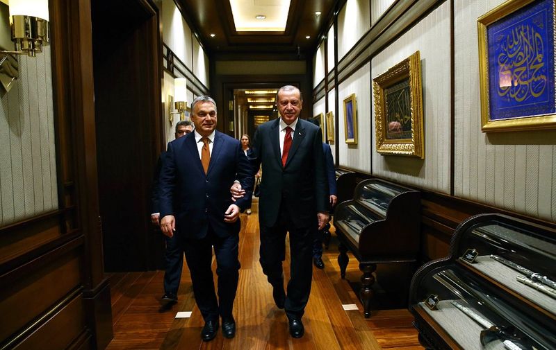 In this handout photograph released by the Turkish President's Press Office on June 30, 2017, Turkey's President Recep Tayyip Erdogan (R) walks with Hungary's Prime Minister Viktor Orban before a meeting in Ankara. (Photo by HO / TURKISH PRESIDENT PRESS OFFICE / AFP) / RESTRICTED TO EDITORIAL USE - MANDATORY CREDIT "AFP PHOTO/TURKISH PRESIDENT'S PRESS OFFICE" - NO MARKETING NO ADVERTISING CAMPAIGNS - DISTRIBUTED AS A SERVICE TO CLIENTS