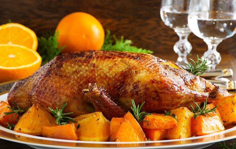 Roast duck with pumpkin and oranges.