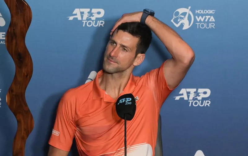 Serbian tennis player Novak Djokovic attends a press conference with the winner's trophy after the final of the ATP Adelaide International tournament against Sebastian Korda of the US at the ATP Adelaide International tournament in Adelaide on January 8, 2023. (Photo by Brenton EDWARDS / AFP)