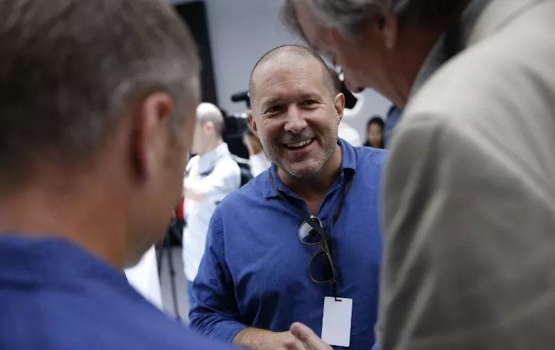 SAN FRANCISCO, CA - SEPTEMBER 07: Apple Chief Design Officer Jonathan Ive (C), shares a laugh with actor Stephen Fry (R) during a launch event on September 7, 2016 in San Francisco, California. Apple Inc. unveiled the latest iterations of its smart phone, the iPhone 7 and 7 Plus, the Apple Watch Series 2, as well as AirPods, the tech giant's first wireless headphones.   Stephen Lam/Getty Images/AFP